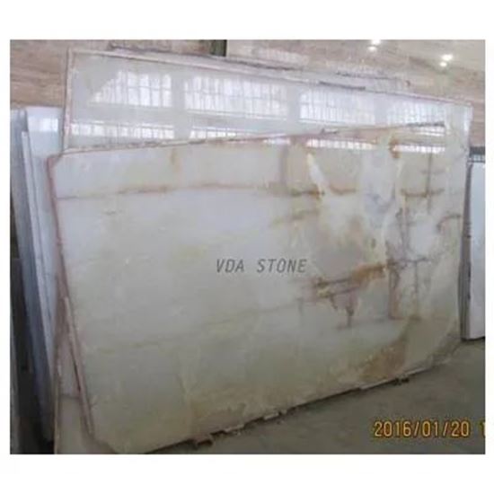 Picture Of White Onyx Slabs with yellow lines