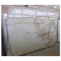 White Onyx Slabs with yellow lines